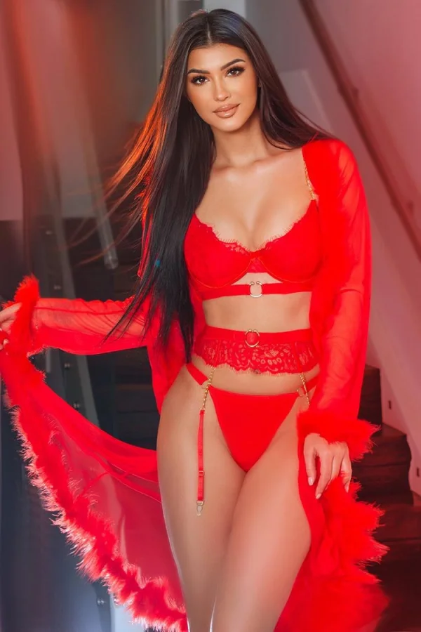 A close up photo of Simeria in sexy red lingerie 
