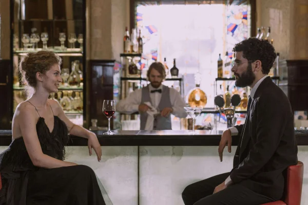 an escort meeting a client at a bar