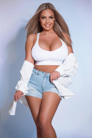 Blonde woman wearing a white crop top 