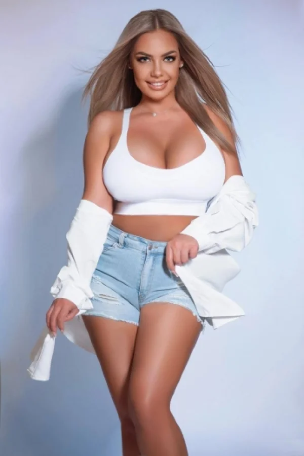 Blonde woman wearing a white crop top 