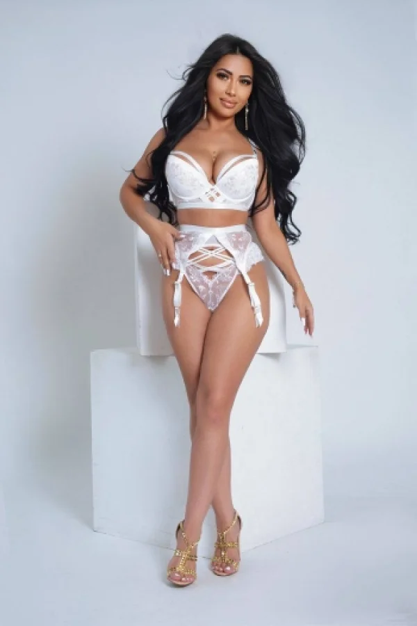 Busty brunette lady Kim wearing white lingerie and gold high heels 