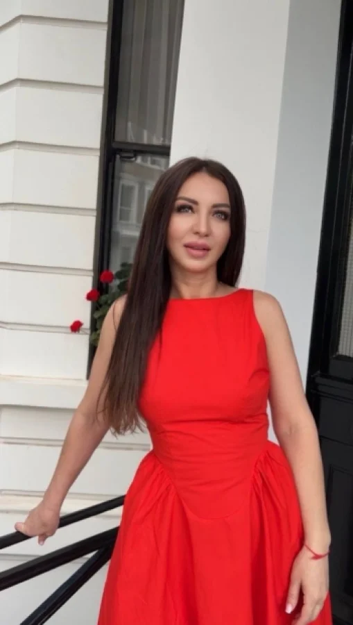 Sophisticated portrait of Alexandra wearing an elegant red dress in Kensington