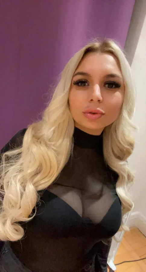 Busty blonde escort Tiffany has curly hair in this selfie 