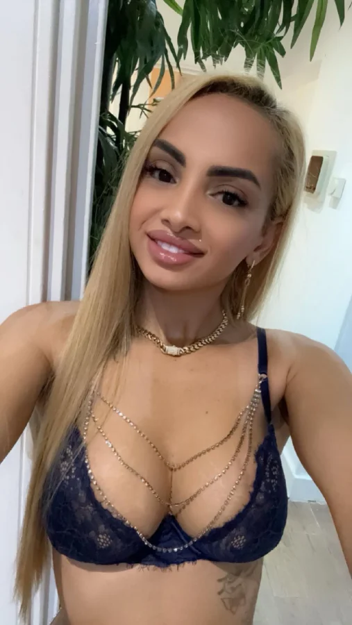 A selfie of a slim blonde escort in blue underwear 