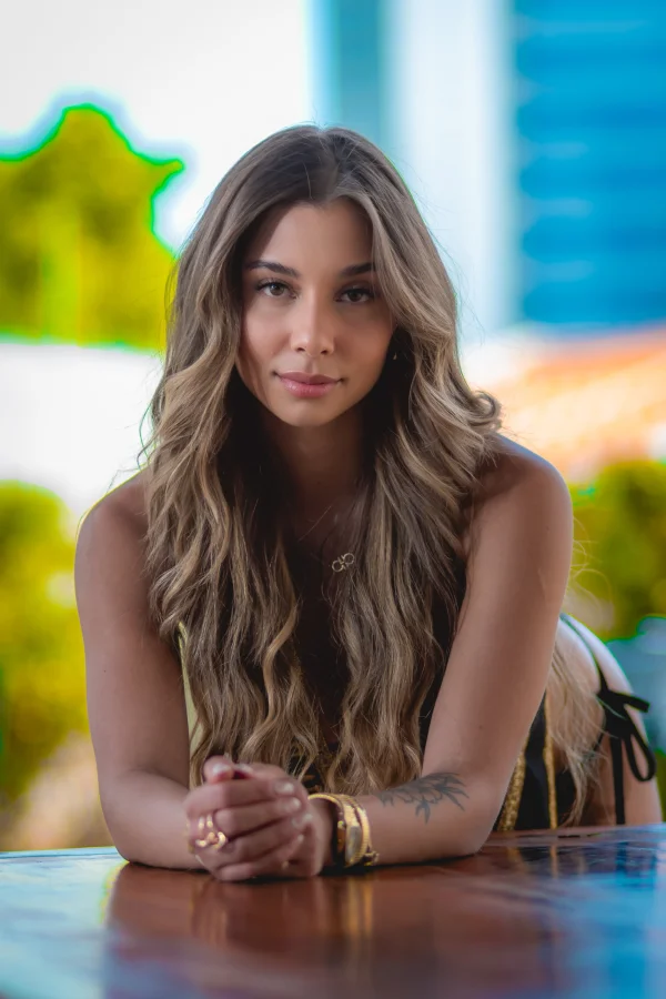 Close up photo of Raine with her hair flowing down over her shoulders