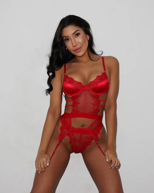 A brunette lady is looking very sexy wearing red lingerie 