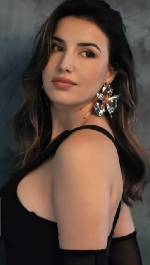 Pretty brunette woman wearing a black dress 