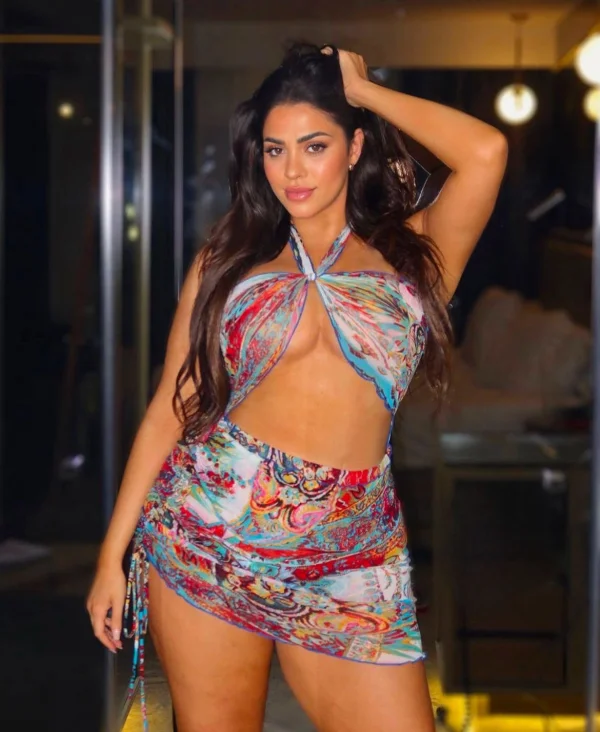 Brenda is showing off her large tits and big arse in this photo 