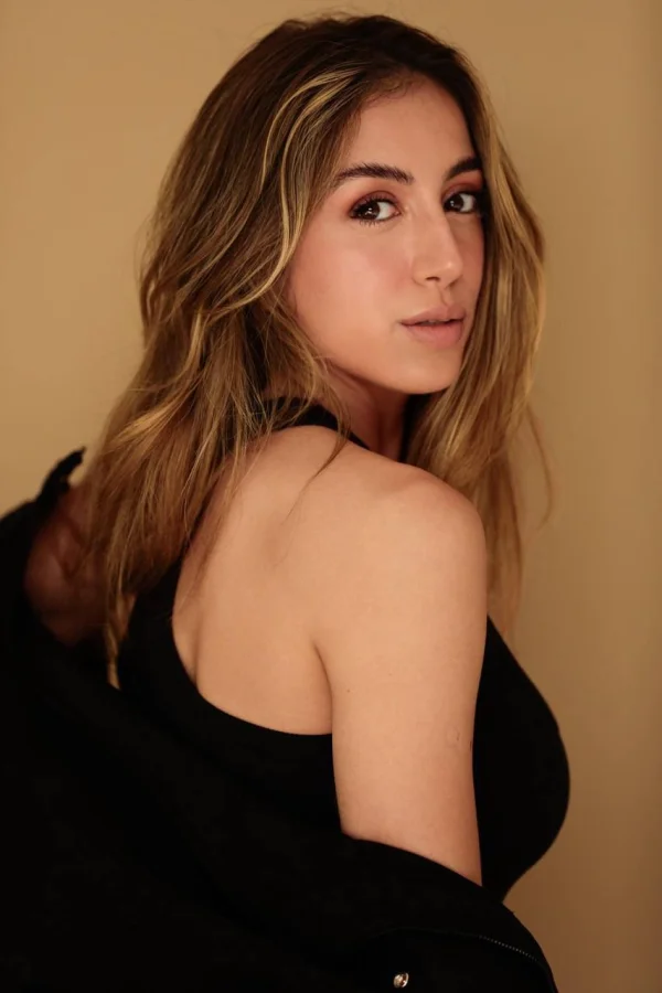 Gabriella is wearing a top that is off her shoulder 