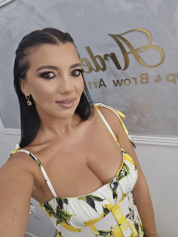 Beauty in yellow print dress looking chic,