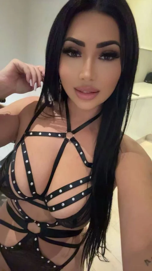 Busty brunette lady is taking a selfie 