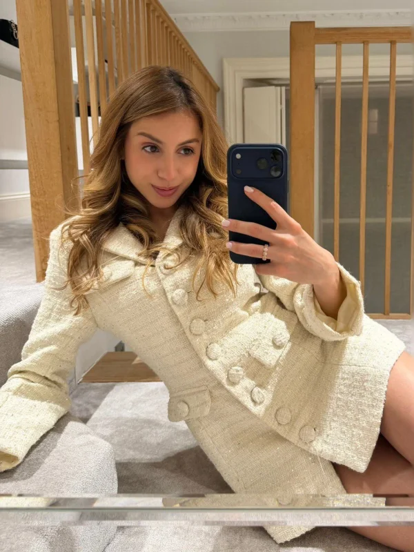 London escort Gabriela taking a selfie while sat on the floor 