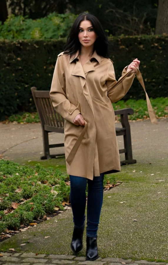Stunning brunette lady wearing a mac and a belt 