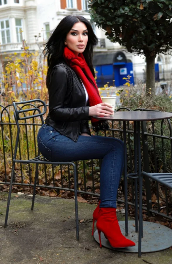 Beautiful brunette lady enjoying a coffee in the park 