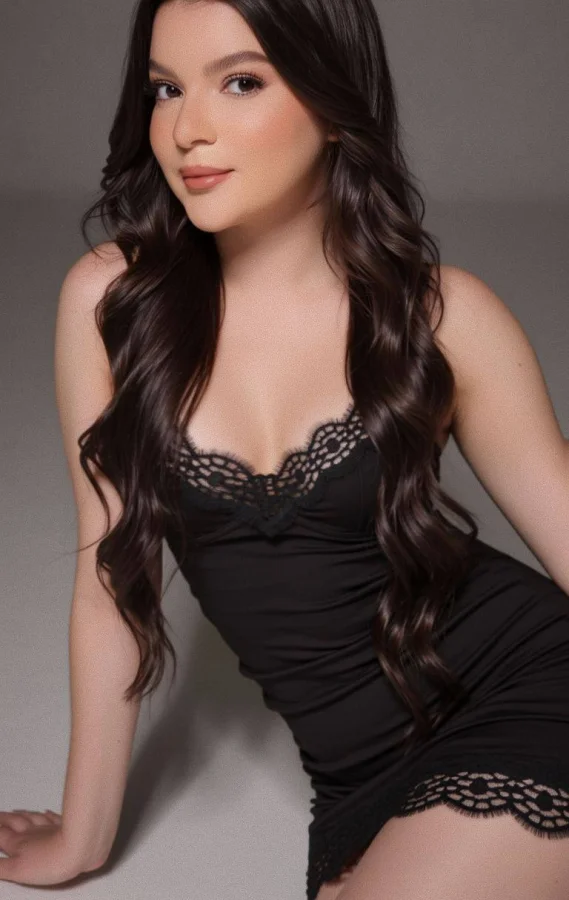 Mila is sat on the floor and is wearing her sexiest black lingerie 