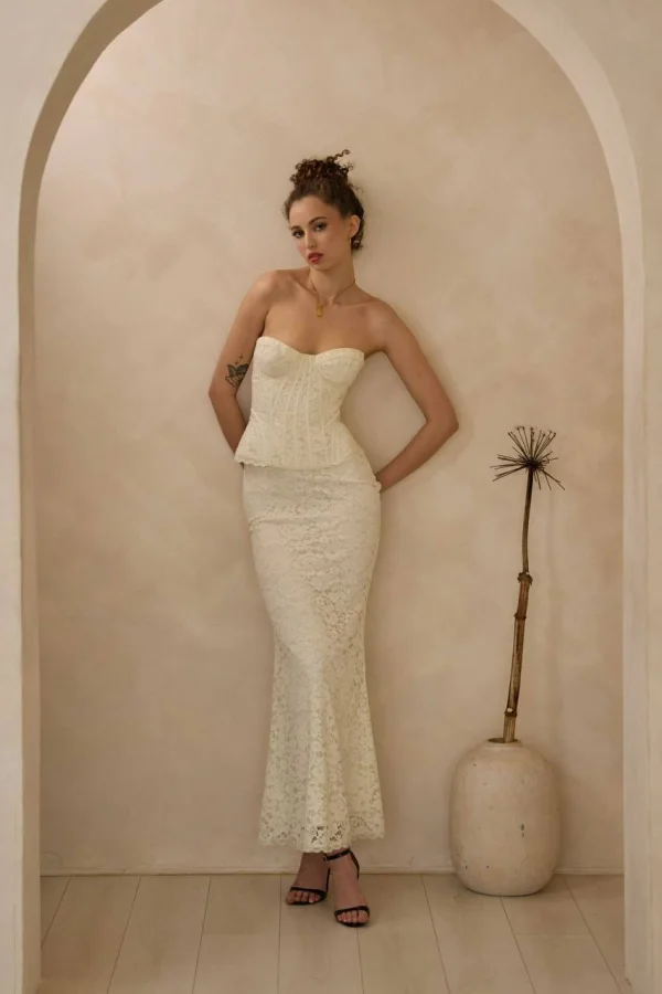 VIP London escort Mell pictured wearing a long white dress 