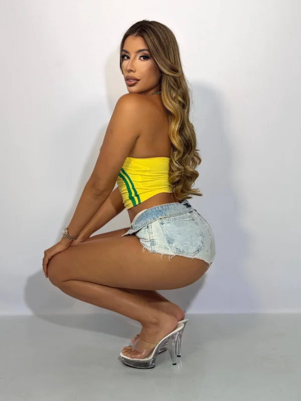 Brazilian escort Camila crouching down wearing stripper heels