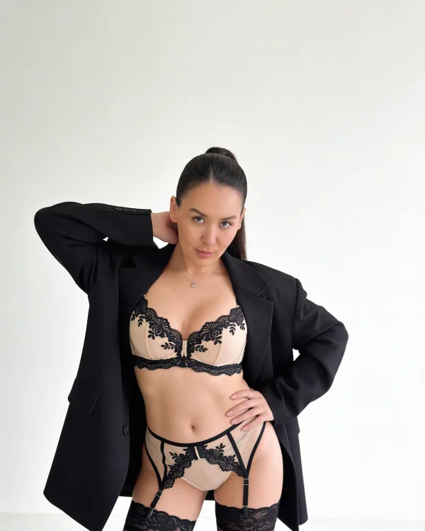 Mistress Lui is pictured wearing cream and black lingerie 