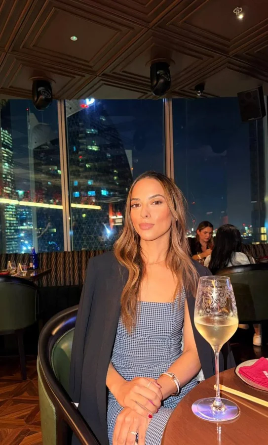 Auri wearing a blue dress while on a dinner date 