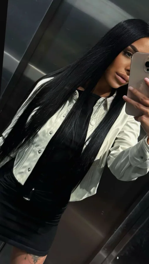 Young lady taking a lift selfie 