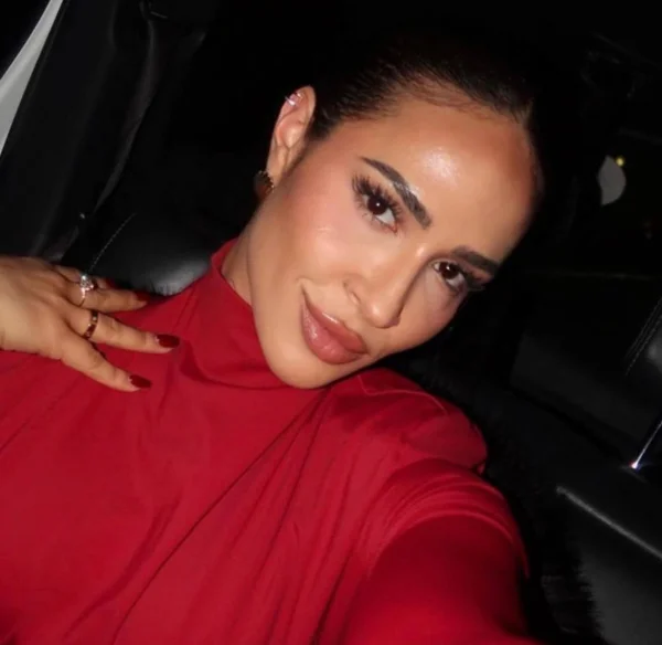Samantha photographed from a front-facing angle while seated in a car