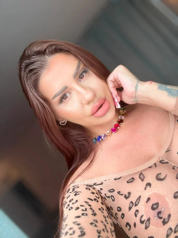 Eastern European brunette Diandra wearing a rainbow gemstone necklace