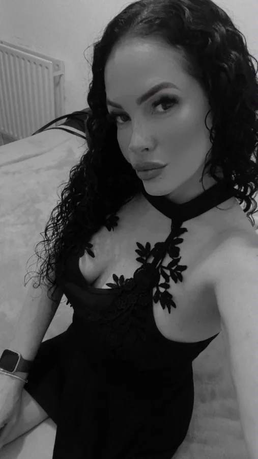 Mella black and white selfie wearing a black lace top